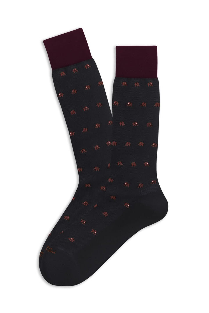 Bas fantaisie avec motif d'éléphants miniatures sur fond noir et côtes bordeaux en haut, confort et style.