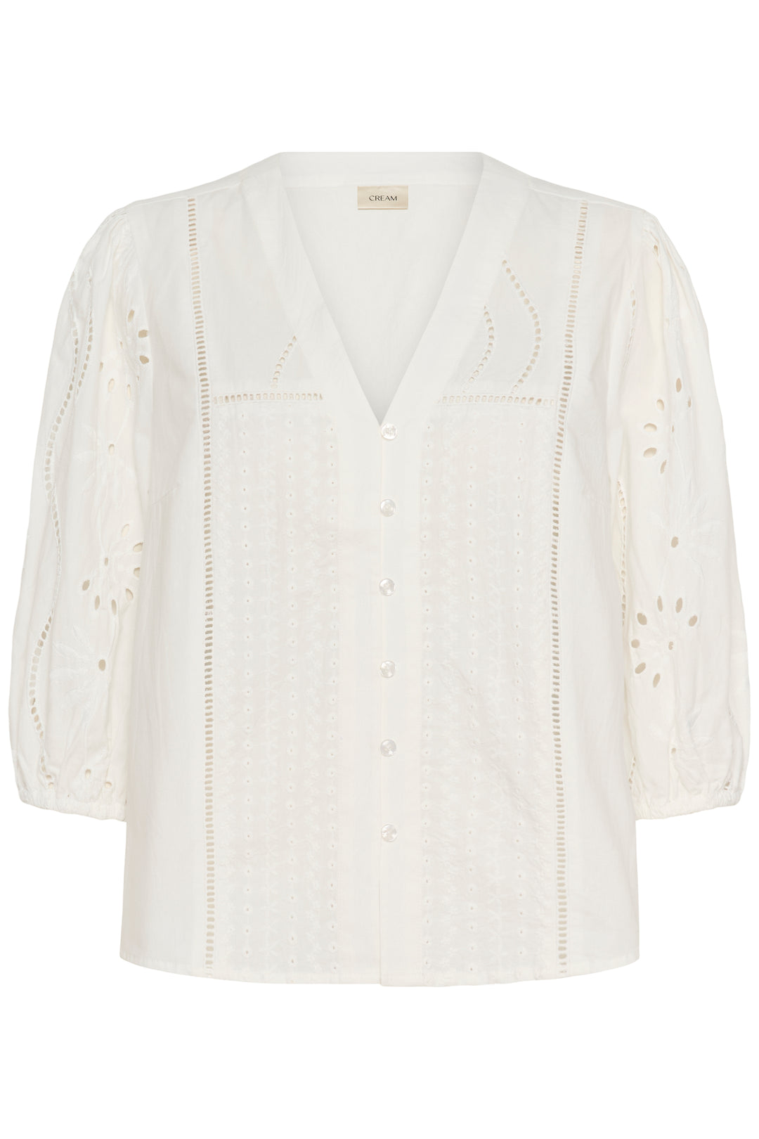 Blouse Signe avec détails ajourés, broderies élégantes et encolure en V, féminine et sophistiquée.