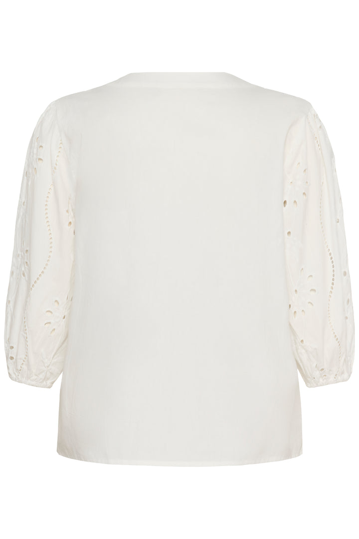 Blouse Signe blanche avec détails ajourés et broderies raffinées, vue de dos, coupe fluide et encolure en V élégante.