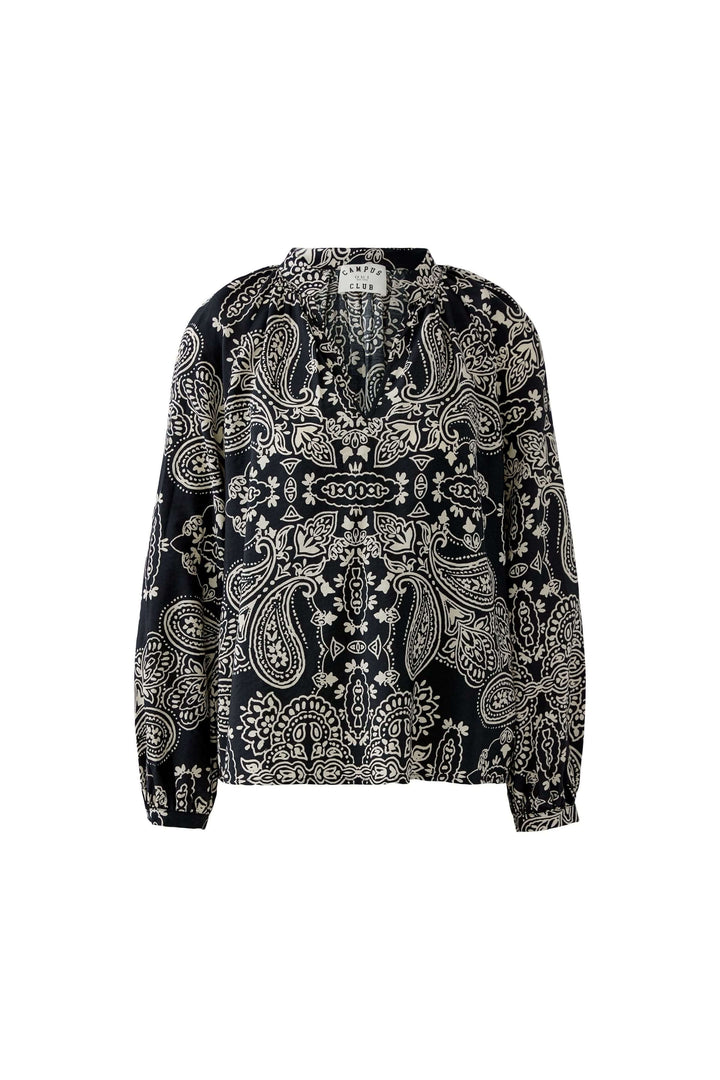 Blouse fluide imprimé graphique avec motif bohème élégant et encolure ouverte, idéale pour un look féminin et naturel.