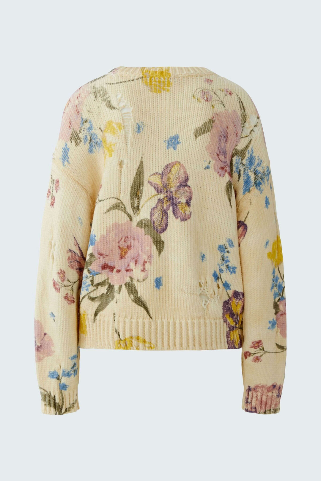Chandail vintage tendance en maille avec imprimé floral artistique et coupe décontractée, idéal pour un look doux et expressif.