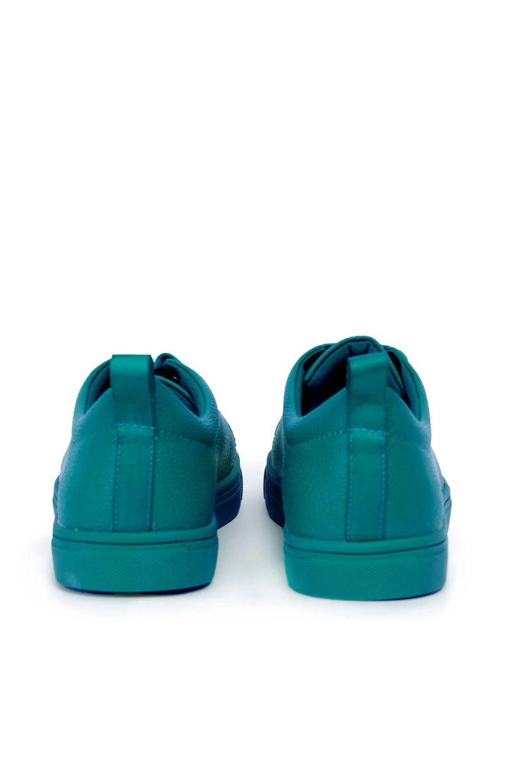 Vue arrière de chaussures simples à lacets pour femme, en teintes turquoise et design moderne.
