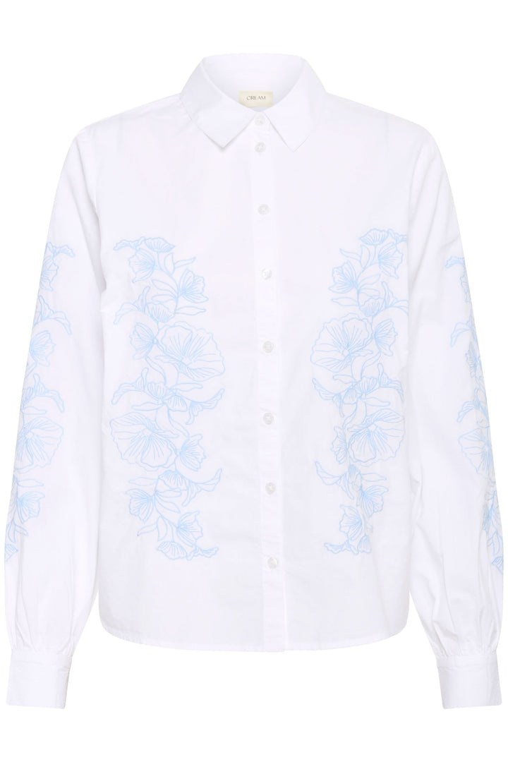 Chemise Jolene avec motif floral bleu, coupe droite et col classique, style élégant pour confort quotidien.