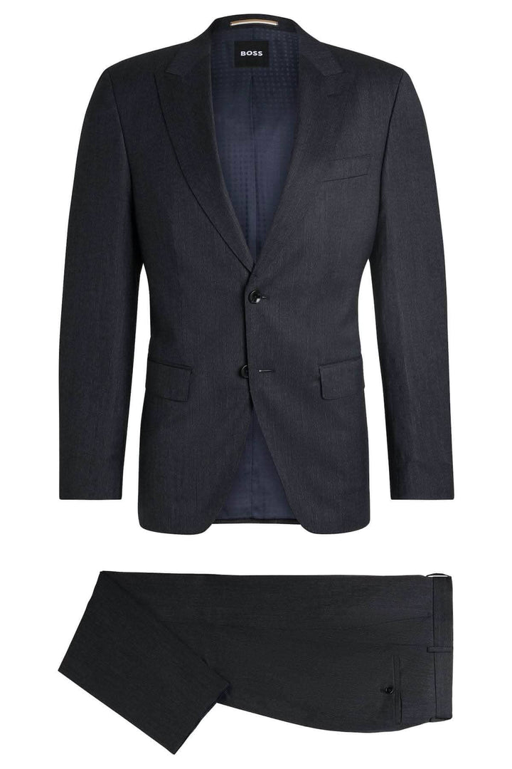 Complet slim à micro-motifs, élégant avec veste structurée et pantalon assorti, parfait pour occasions professionnelles.