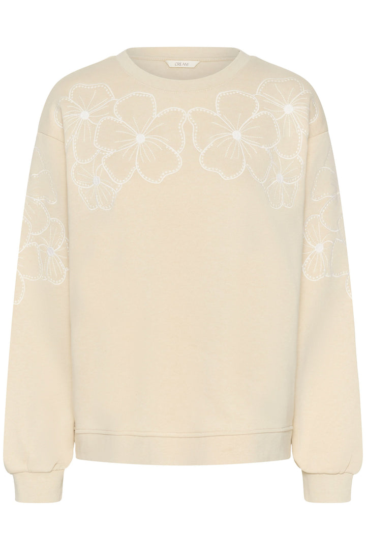 Coton ouaté Daria avec motif floral délicat, allure douce et féminine, parfait pour une garde-robe décontractée et soignée.