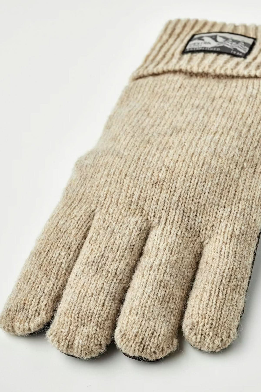 Ganst en maille beige, protection confortable et fonctionnelle pour journées fraîches, souplesse, maintien, poignets côtelés.