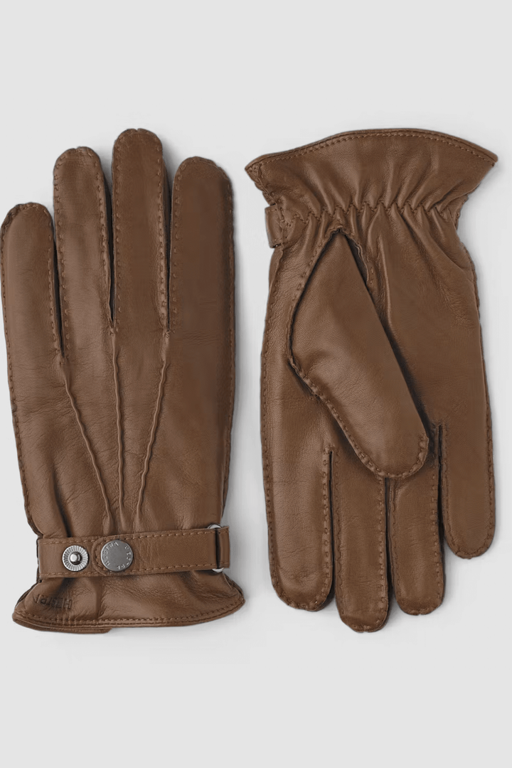 Gants de cuir marron en nappa d'agneau italien, doublés en laine tricotée et finition élégante avec bouton-pression.