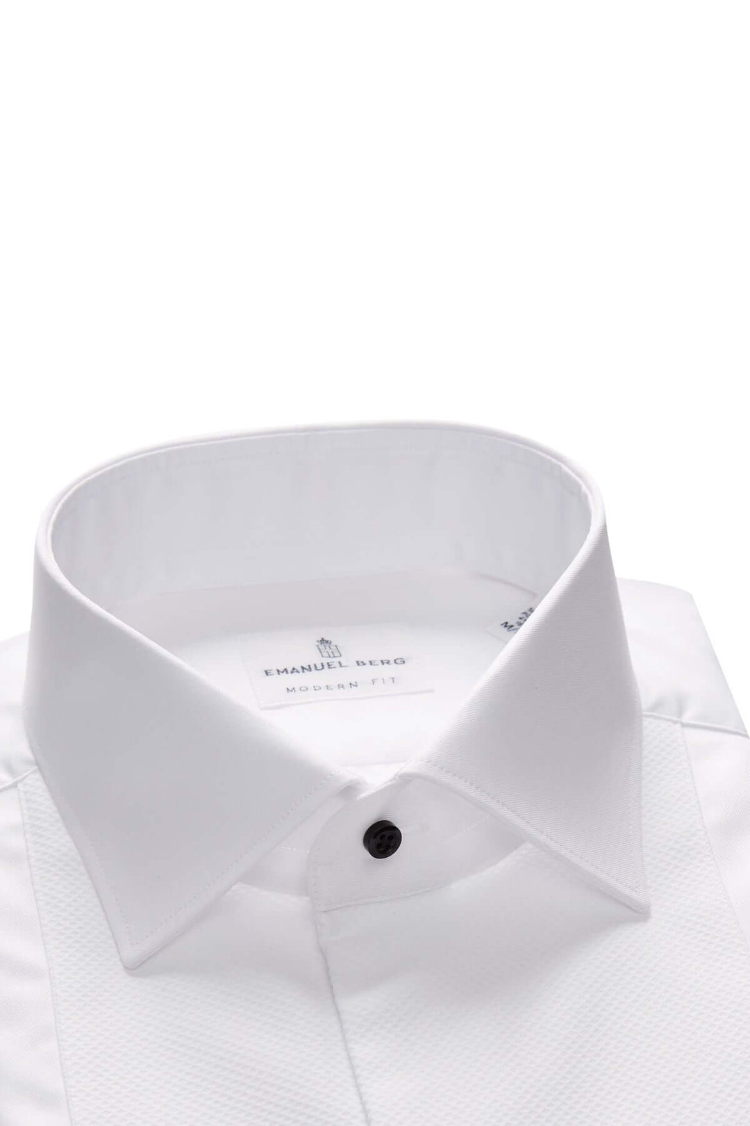 Col classique rigide d'une chemise habillée avec boutons noirs élégants, symbole d'élégance intemporelle.