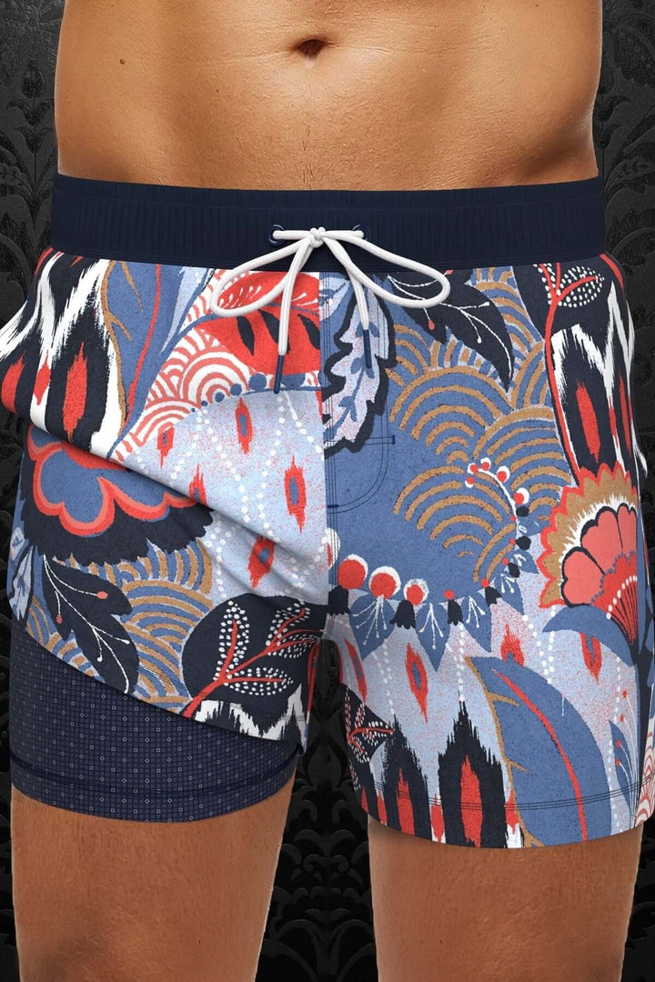 Maillot de bain Lemberg avec motif tropical coloré et taille élastique, parfait pour vos vacances au soleil.