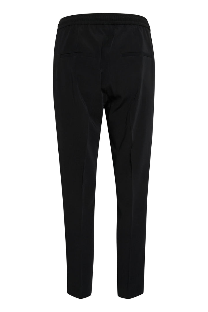 Pantalon Adian noir avec taille élastique, poches, coupe décontractée et longueur cheville.