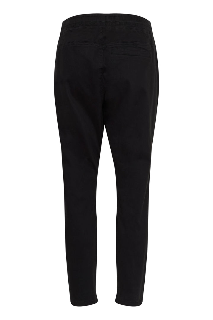 Pantalon décontracté noir pour femmes, coupe fuselée avec taille élastique et poches latérales.