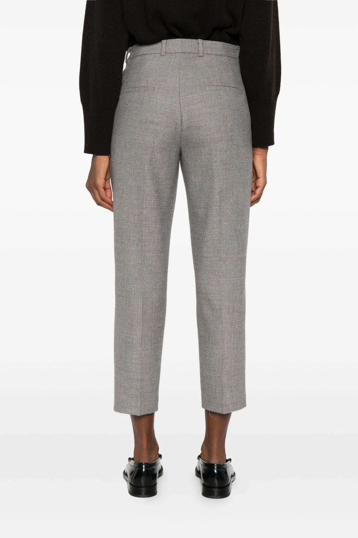 Pantalon Krystal habillé à taille mi-haute en tissu gris, coupe ajustée, longueur cheville, pour un style élégant et formel.