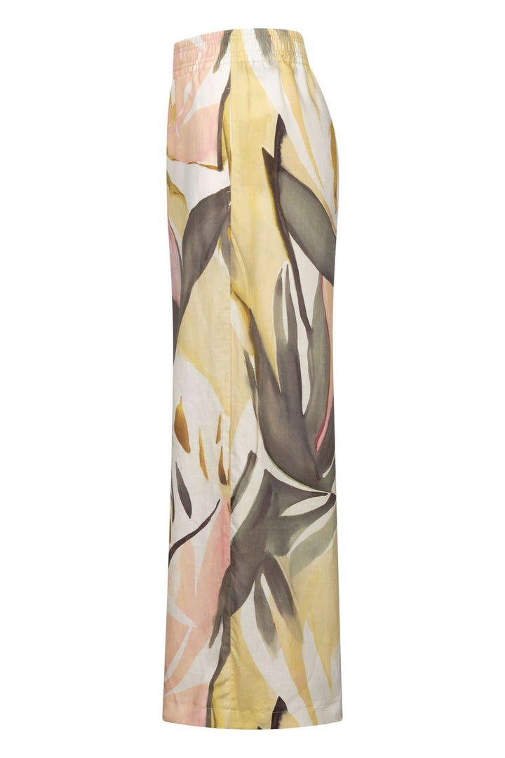 Pantalon Lizett fluide imprimé à taille élastique avec imprimé artistique, tissu léger et coupe à jambe large en profil latéral.