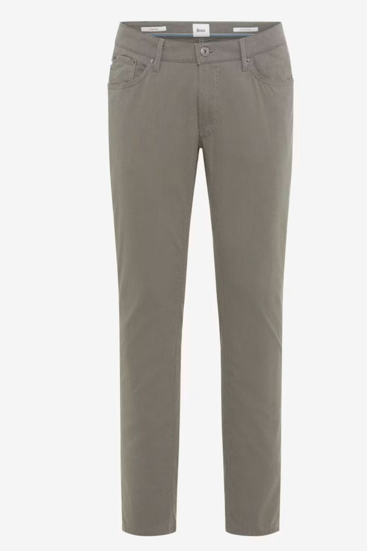 Pantalon ajusté longueur cheville en tissu confortable avec poches et fermeture à bouton, offrant une silhouette moderne pour le quotidien.