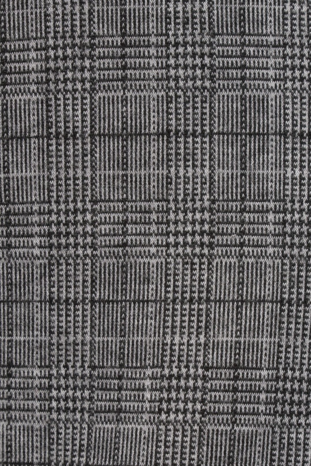 Motif à carreaux prince-de-galles en noir et gris pour pantalon élégant et intemporel.
