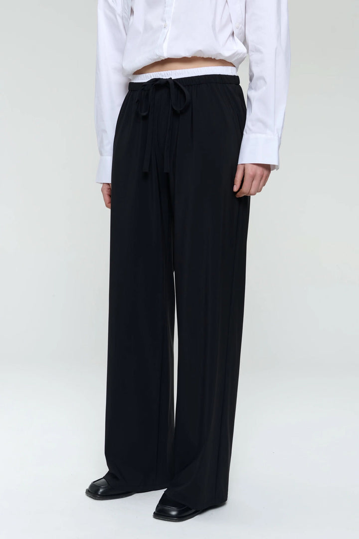 Pantalon ample en jersey Antiny, taille élastique et cordon, idéal pour looks décontractés et raffinés.