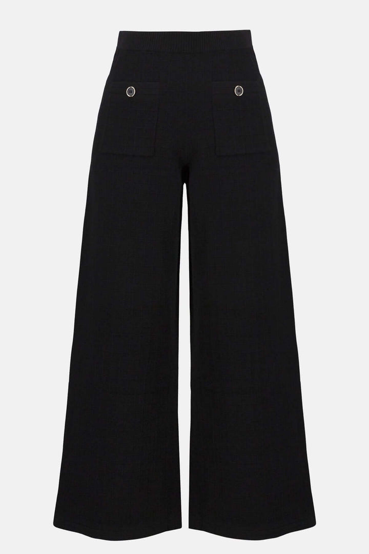 Pantalon noir en tricot ample avec taille haute et poches décoratives. Style fluide et jambe large.