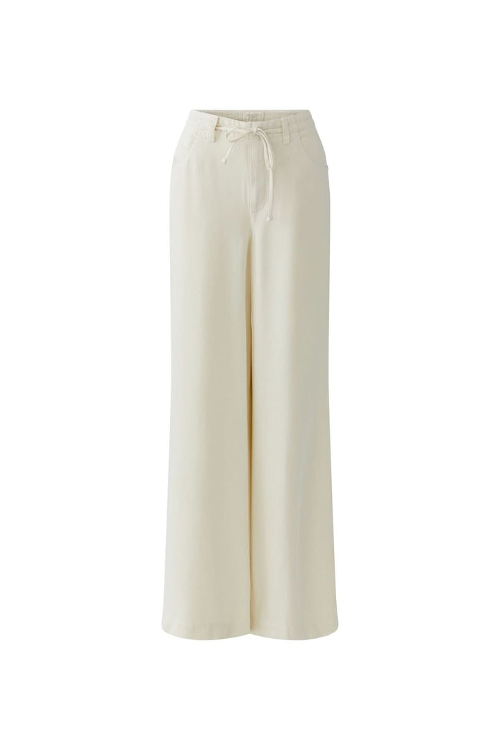 Pantalon fluide à cordon de serrage blanc, coupe large, pour un look moderne et confortable quotidien.