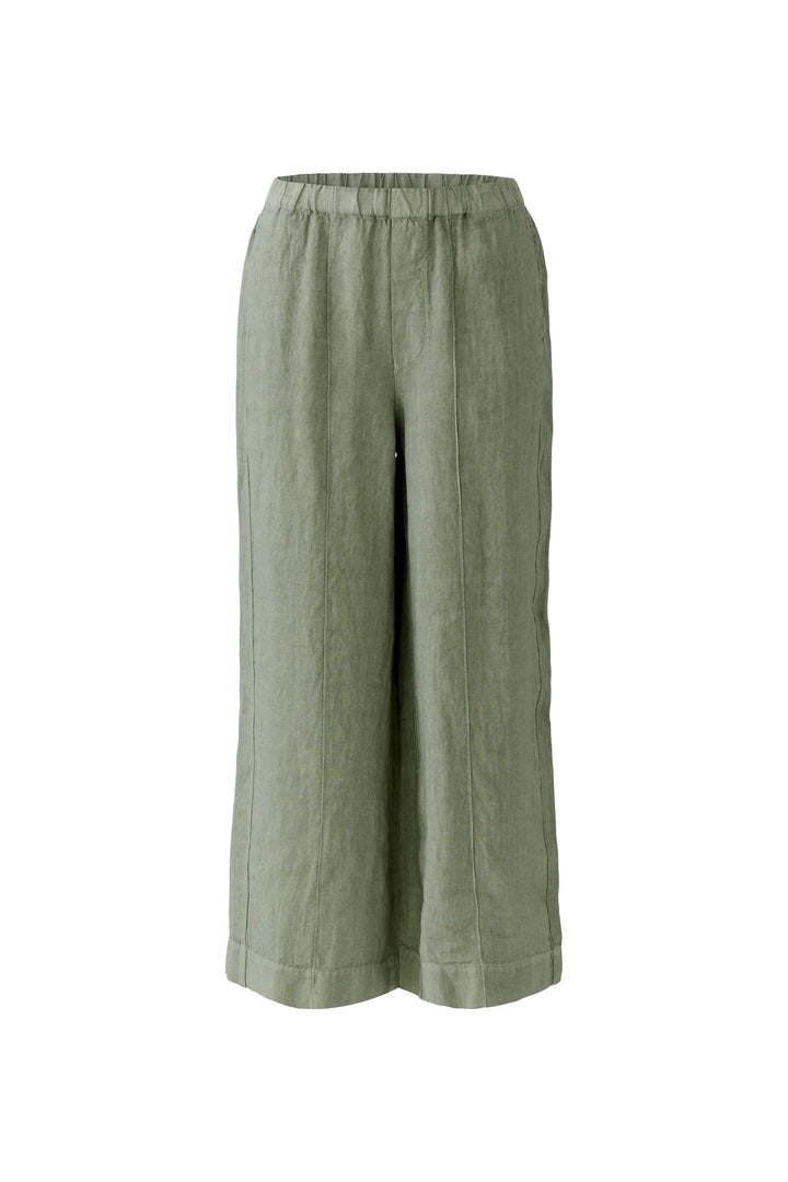 Pantalon fluide en lin à jambe large vert avec taille élastiquée, coupe ample, poches latérales et longueur cheville pour confort quotidien.