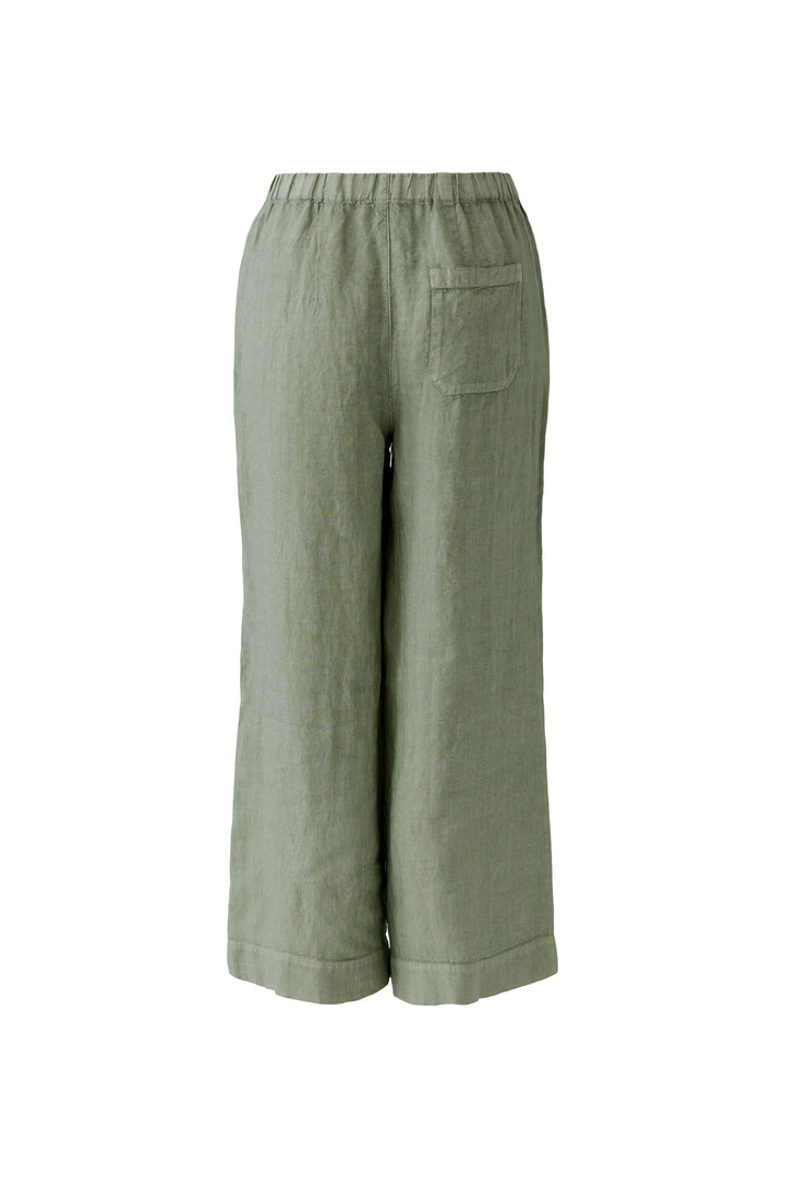 Pantalon fluide en lin à jambe large avec taille élastiquée, coupe ample et poches latérales pour un confort quotidien moderne.