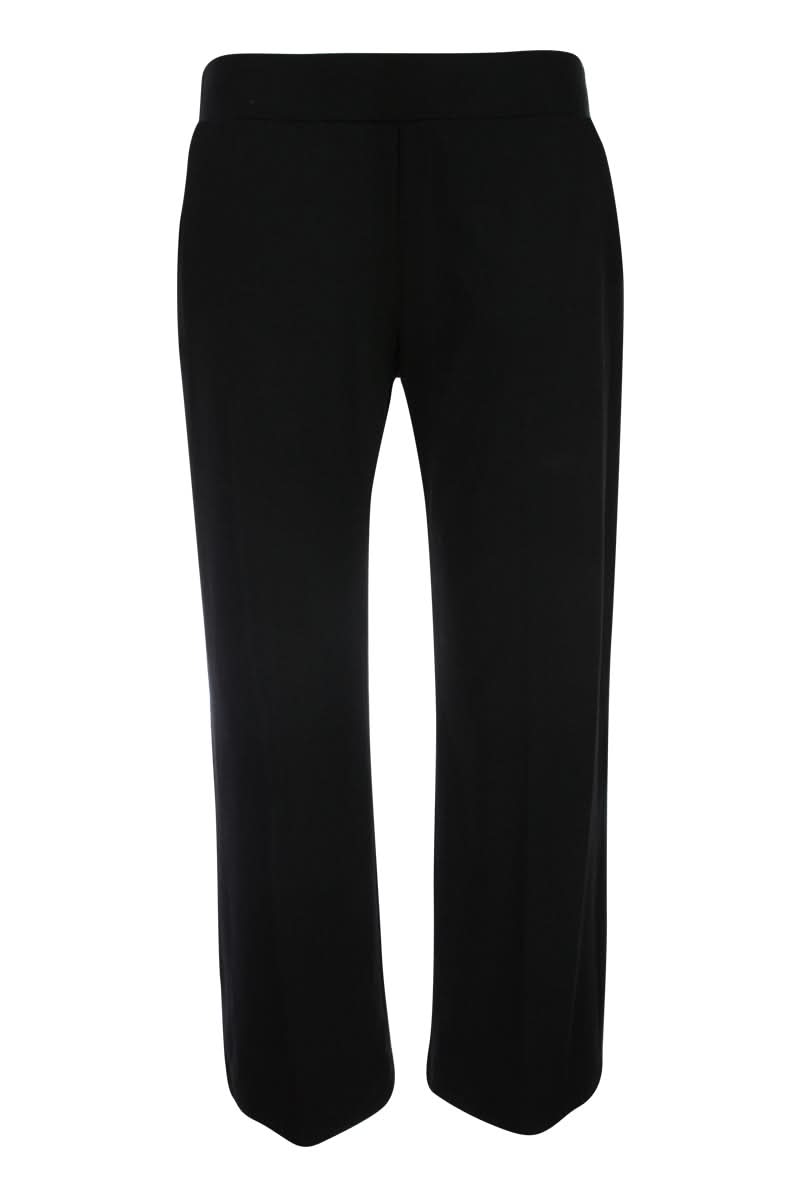 Pantalon jambe large noir avec tissu fluide et coupe élégante, idéal pour une tenue professionnelle ou habillée.