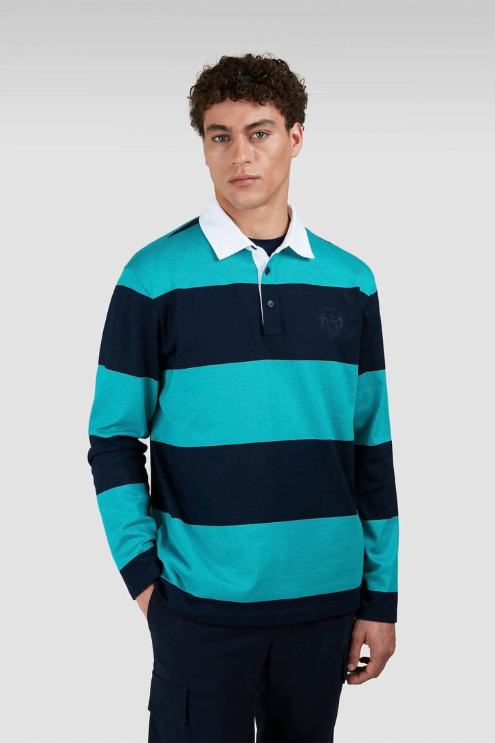 Polo rugby à manches longues rayé turquoise et marine, avec col blanc et coupe confortable pour un look décontracté.