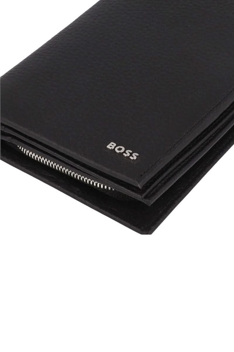 Portefeuille en cuir grainé noir avec logo métallique discret, élégant et fonctionnel pour l'homme moderne