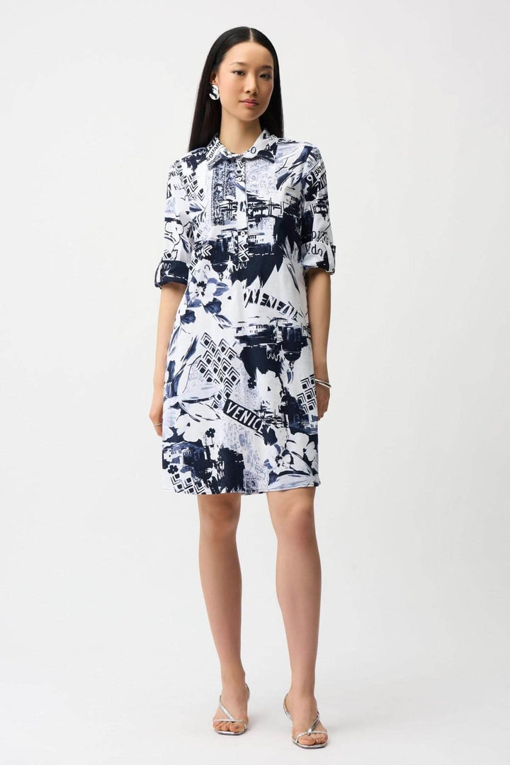 Robe chemise imprimée avec col chemise, manches retroussées, et imprimé graphique moderne pour un style urbain polyvalent.