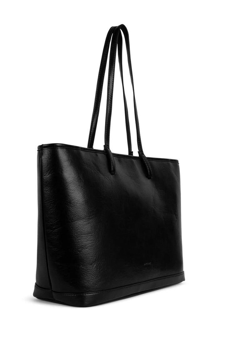 Sac fourre-tout Eliza en cuir noir, avec anses longues et design épuré, idéal pour un usage quotidien.