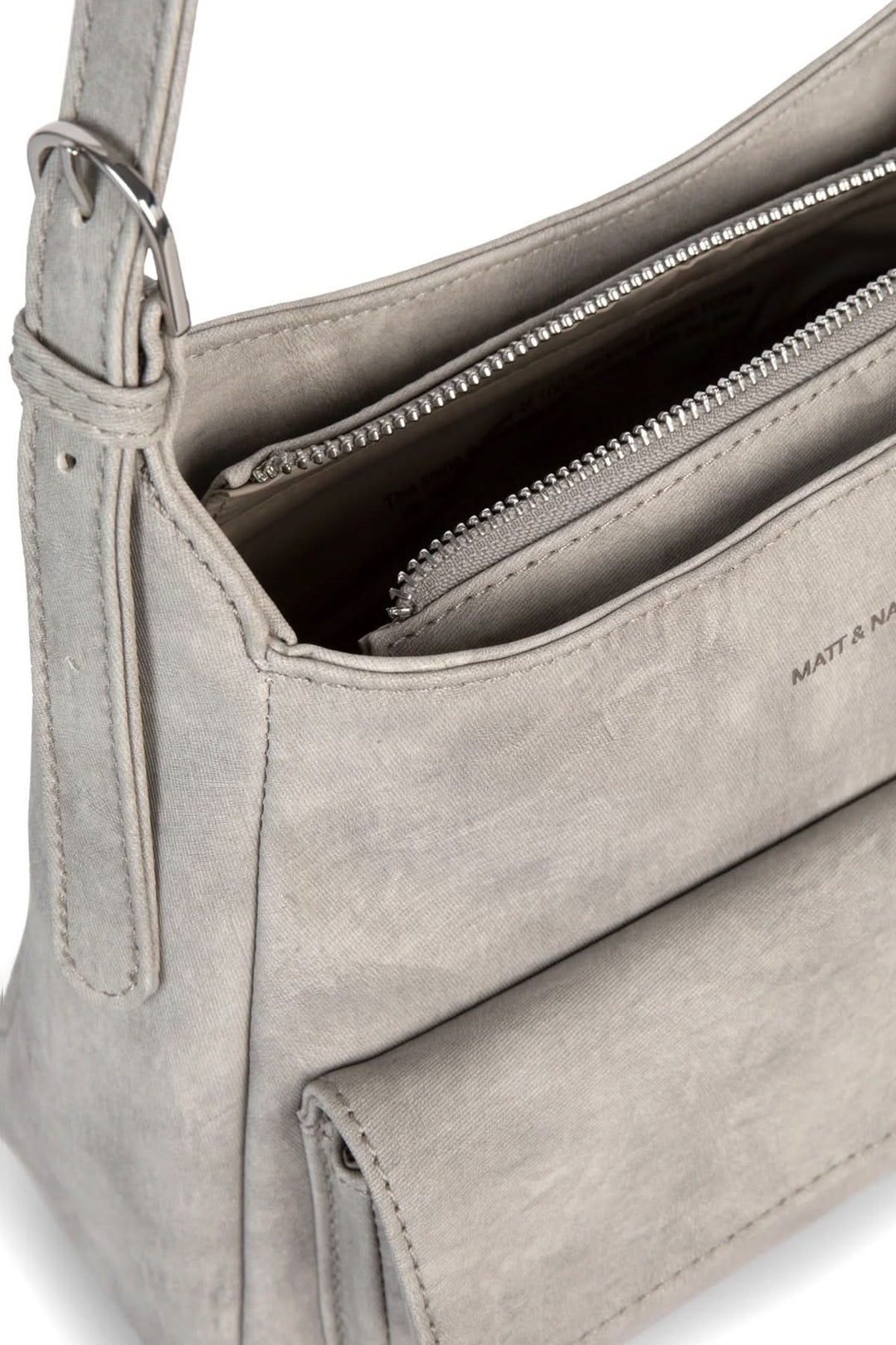 Sac à mains gris avec poche zippée et bretelle ajustable, design pratique et moderne.