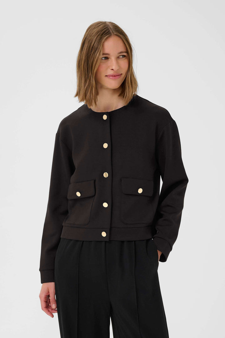 Veste Gida noire à col rond avec boutons dorés et poches, style moderne et chic.