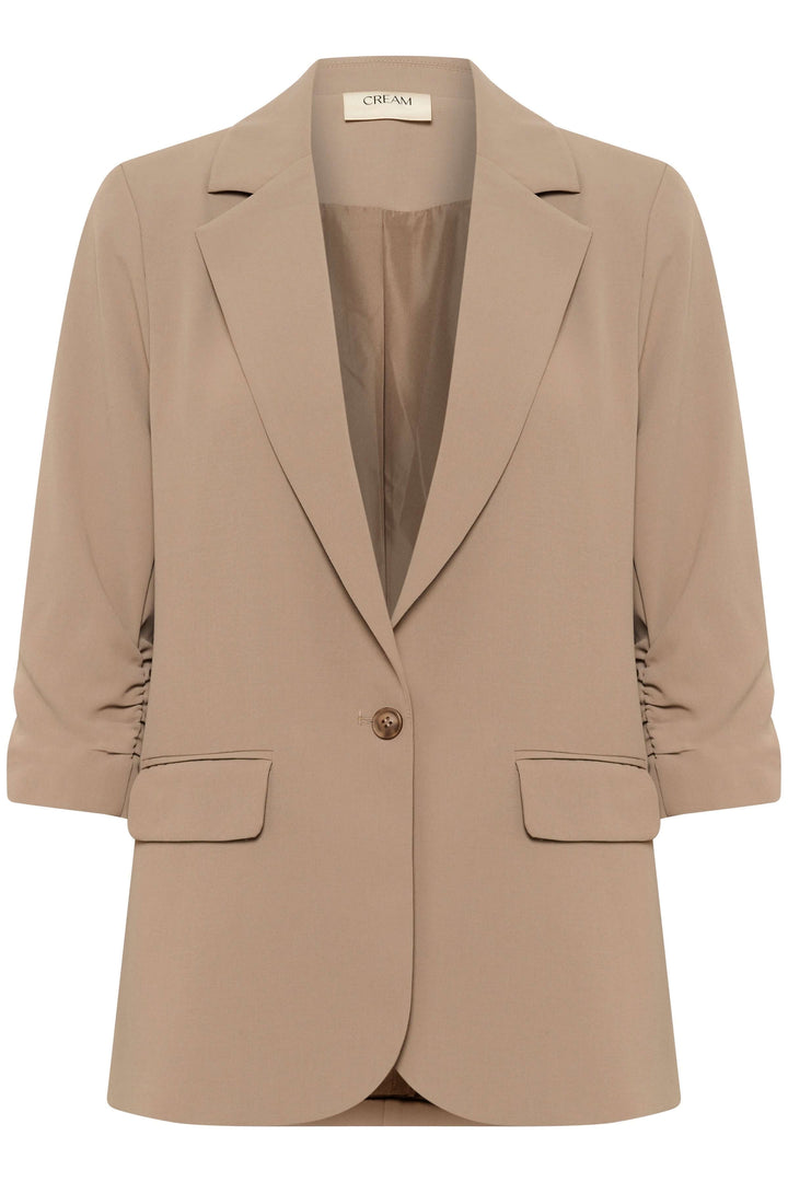 Veston beige à coupe décontractée avec fermeture à un bouton et manches froncées, idéal pour bureau et sorties.