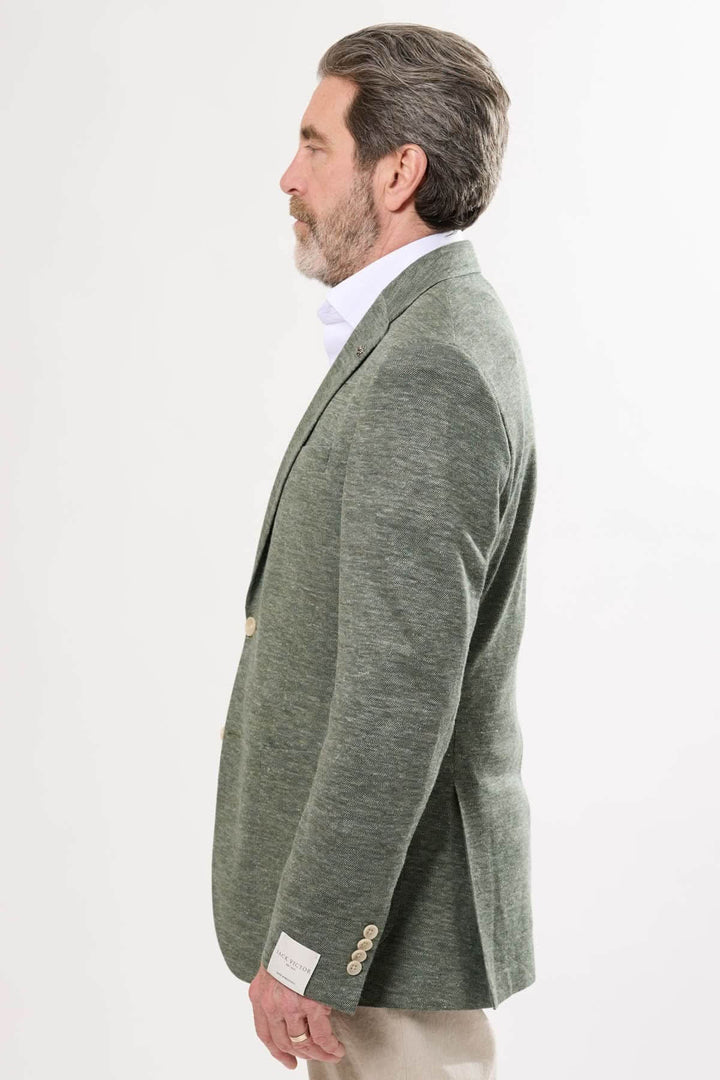Veston texturé vert, coupe moderne, idéal pour tenues chics décontractées, avec fermeture à deux boutons.