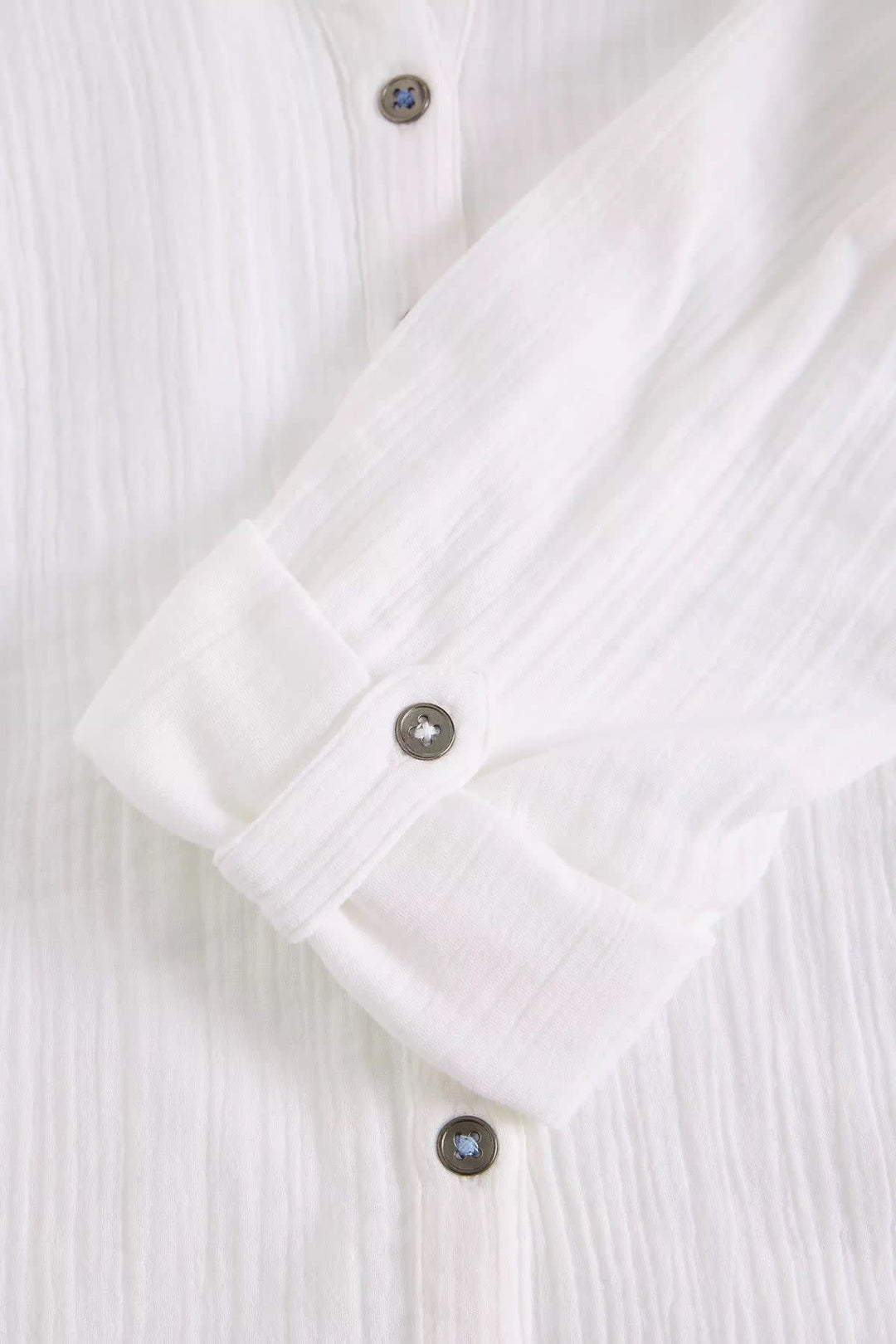 Front view of the blue crinkled blouse White Stuff with buttons for women - Valérie Simon