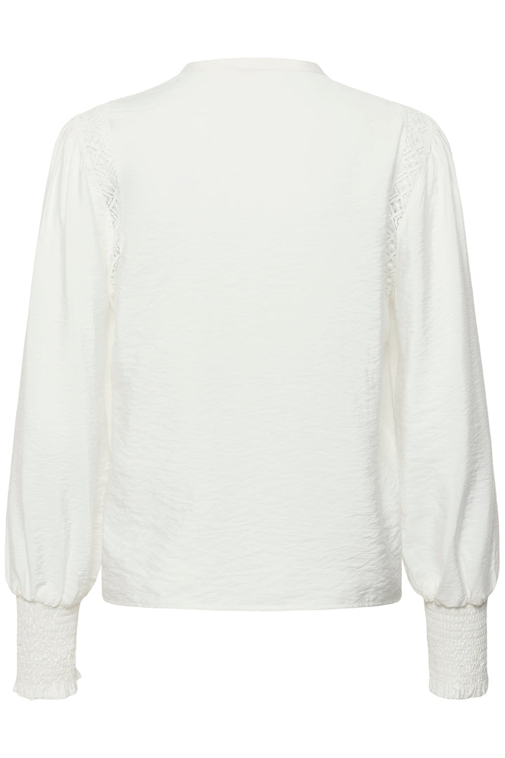 Front view of the Delia Kaffe white lace blouse for women with embroidered details - Valérie Simon