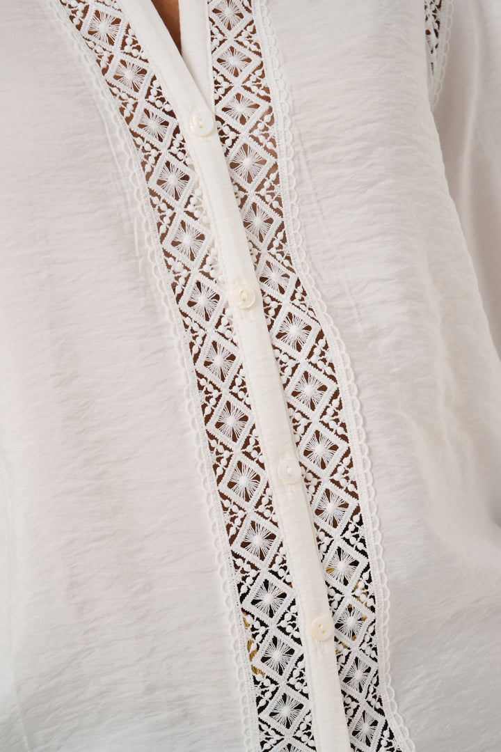 Front view of a collarless Kaffe women&