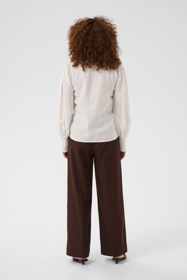 Front view of a white Kaffe blouse with lace details for women - Valérie Simon