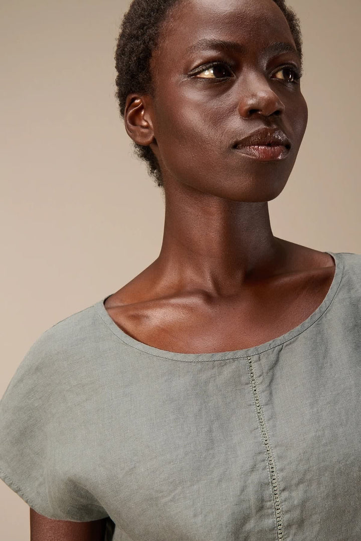 Front view of the Nile linen blouse for women in green with floral buttons - Valérie Simon
