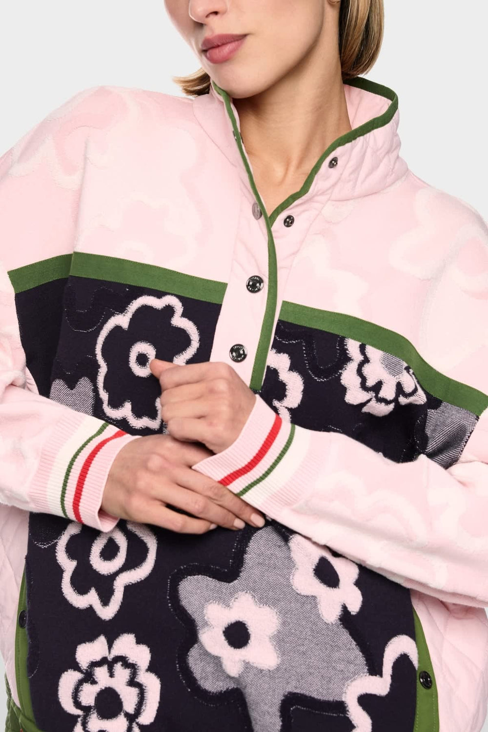 Front view of the women's Marc Cain mock-neck sweater with quilted panels