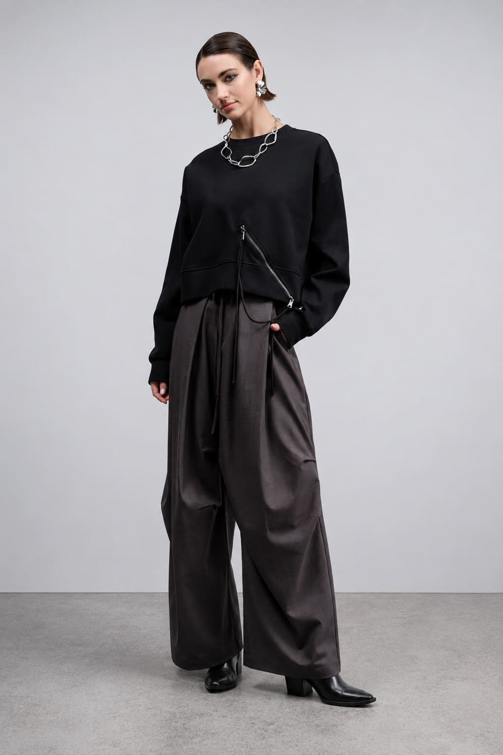 Front view of the red Haako women's zip-up sweater with a high neck and front pockets - Valérie Simon