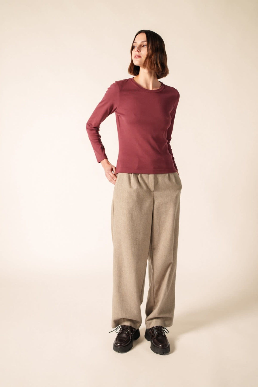 Side view of the CELINA U Saint James burgundy sweater with white stripes - Valérie Simon