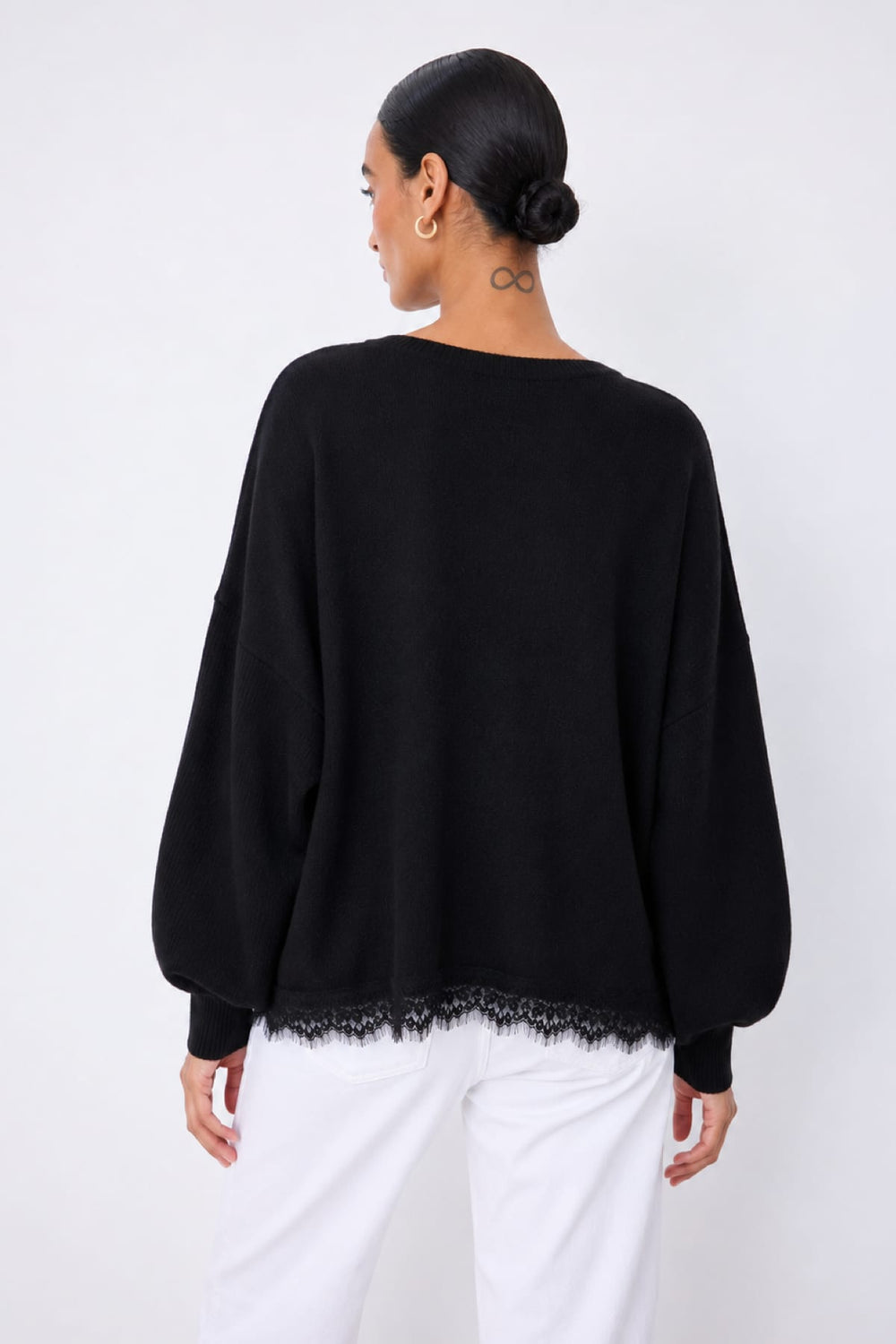 Front view of the women's loose-fit Dilly sweater with lace trim Not Shy