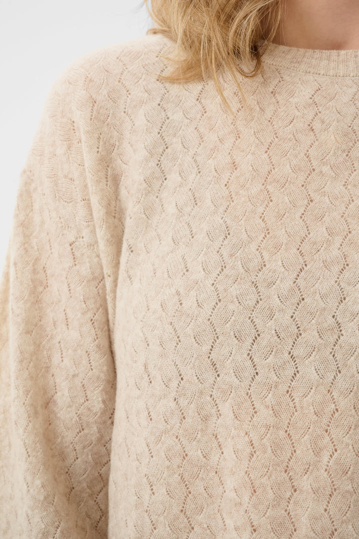 Front view of women’s blue sweater Cream with flared sleeves and openwork knit - Valérie Simon