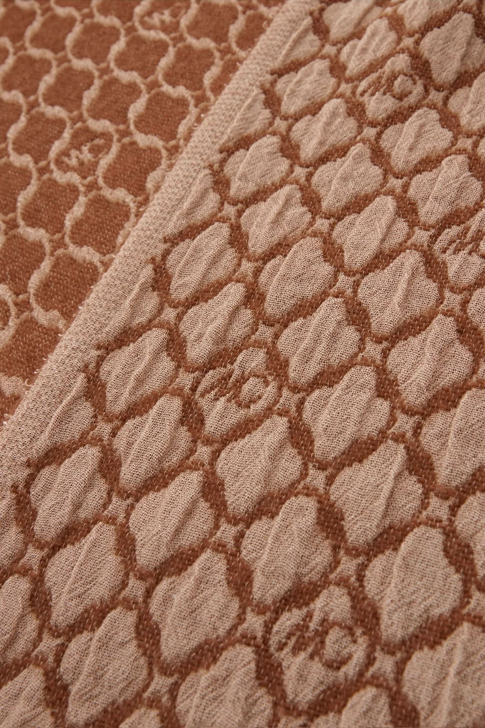 Tissu en laine double face bicolore avec motif textured, couleur beige et marron.