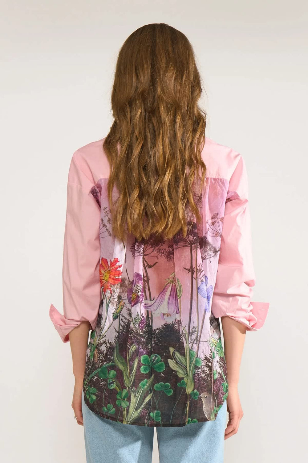 Back view of women's shirt with floral print on the back by Numph