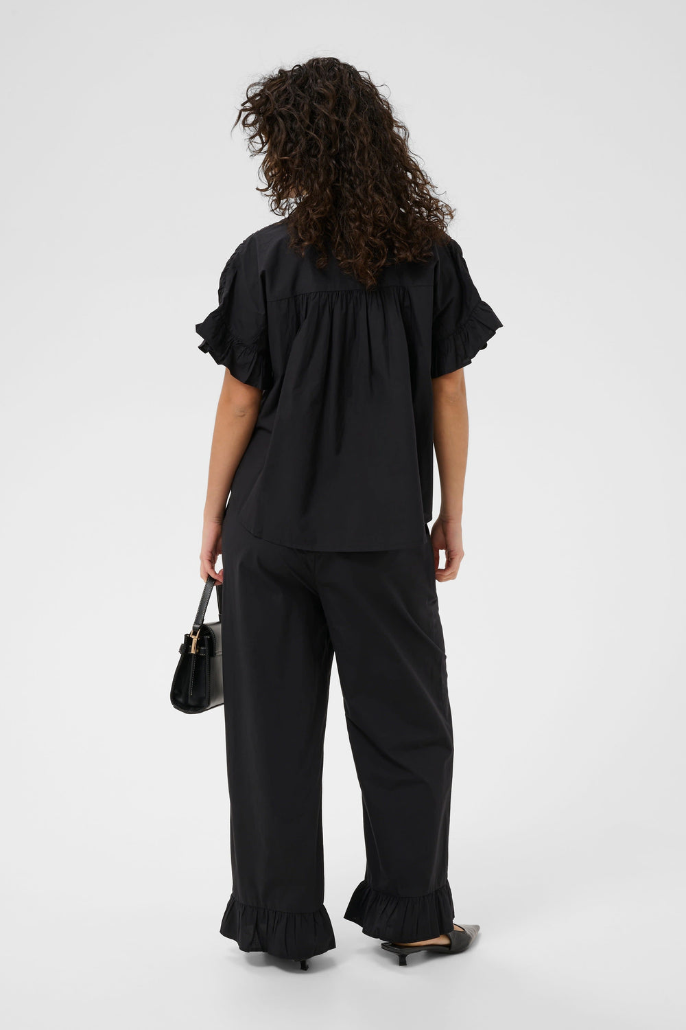 Front view of the Kaffe ruffled blouse for women in mint green - Valérie Simon