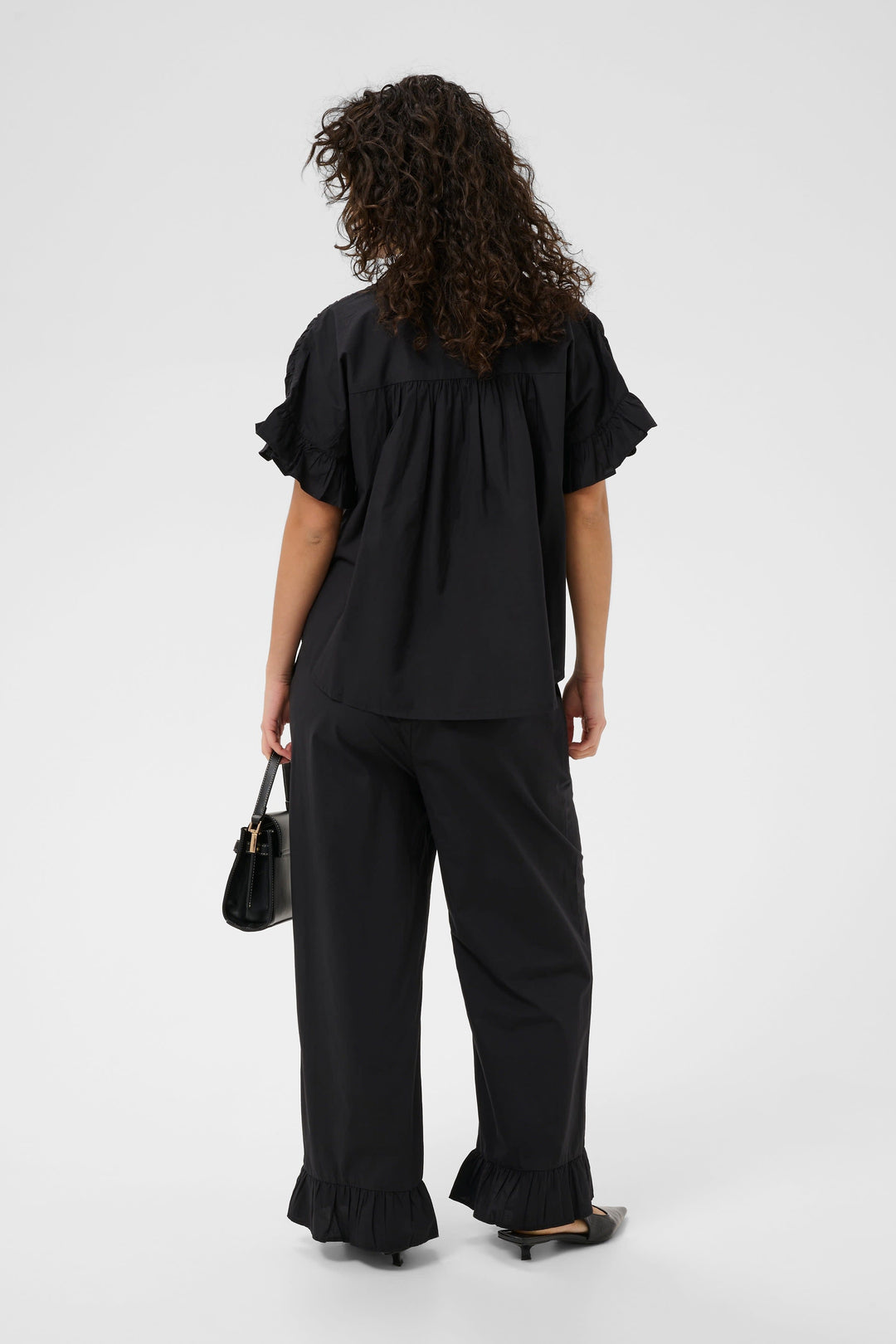 Front view of the Kaffe ruffled blouse for women in mint green - Valérie Simon
