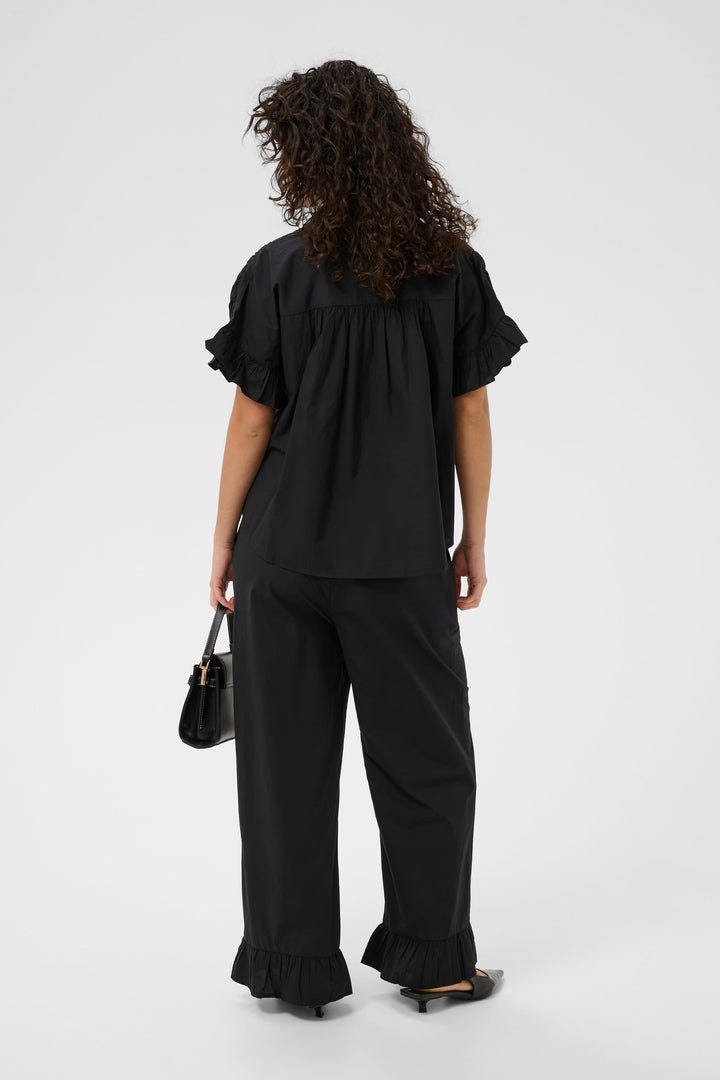 Front view of the Kaffe ruffled blouse for women in mint green - Valérie Simon