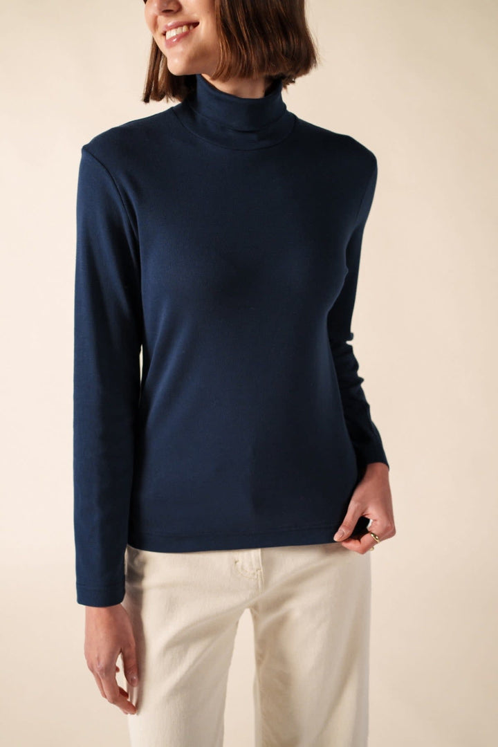 Front view of the Celina Saint James blue turtleneck navy for women with striped details - Valérie Simon
