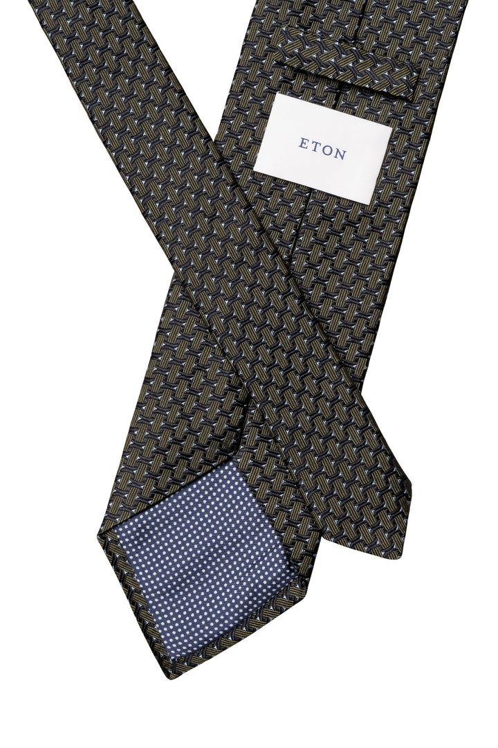 Close-up of a beige Eton silk tie with a geometric pattern in blue and cream - Valérie Simon